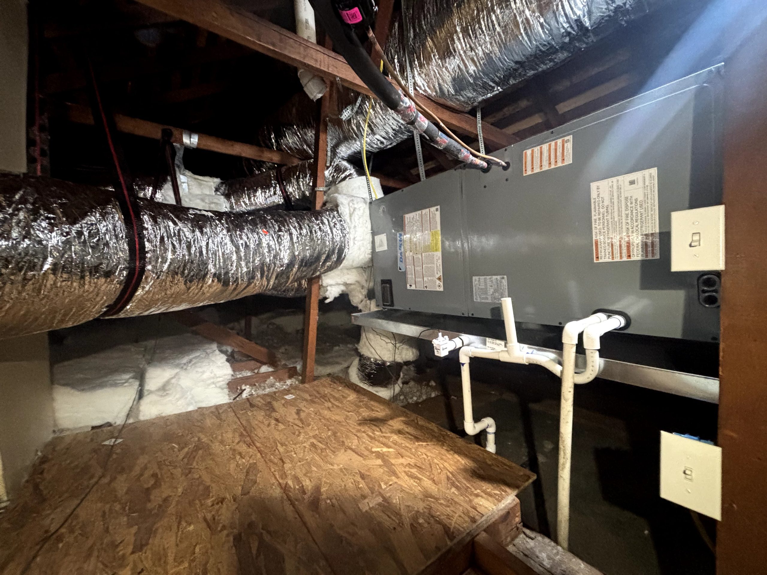 Daikin air handler with condensate drain line installed in an attic by Best HVAC LA